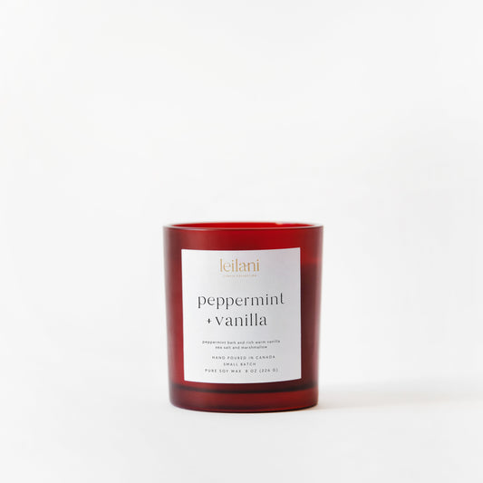 Red candle with a label on a white background