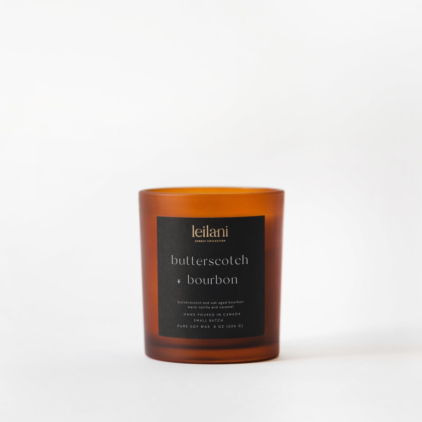 Candle with a black label on a white background
