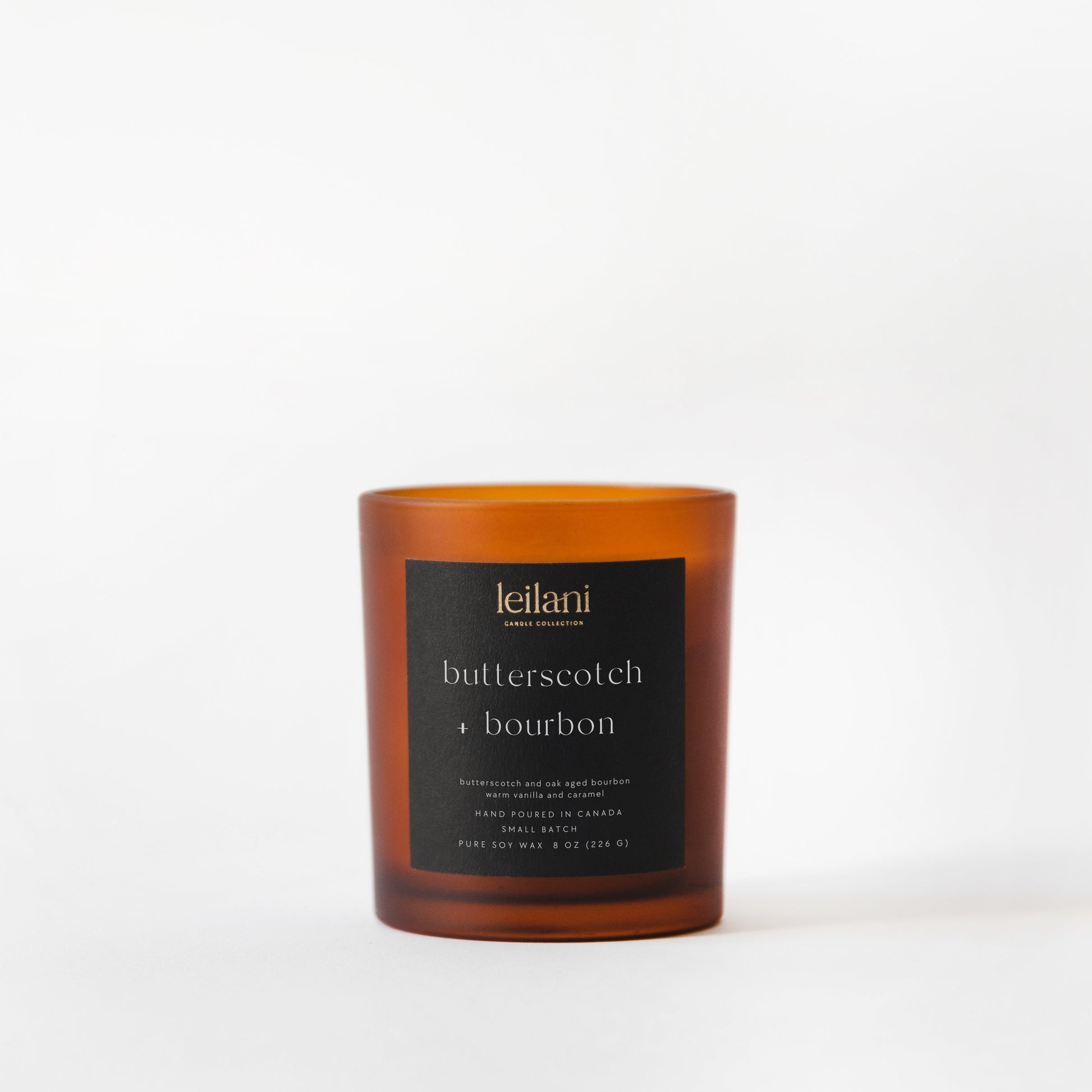 Candle with a black label on a white background