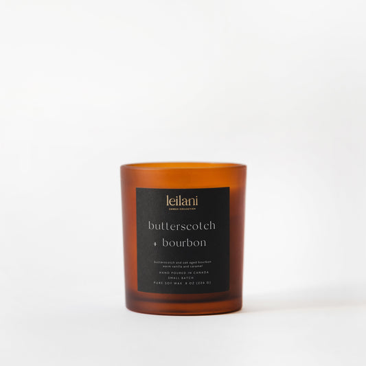 Candle with a black label on a white background